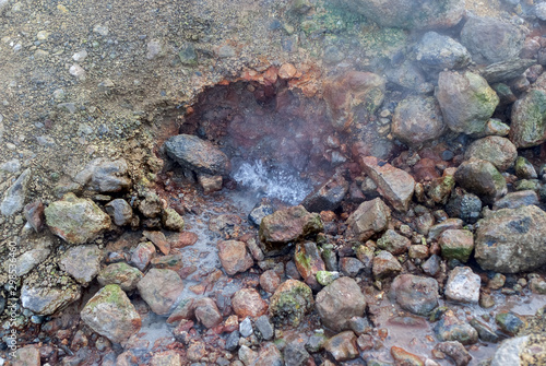 boiling hot spring water, boiling water on the stones of geyser, hot spring soil © daniiD