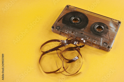 vintage old film music cassette on a yellow background, background music, music lovers