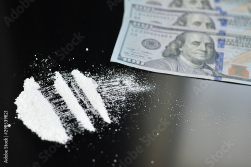 Cocaine divided into paths on a black background.