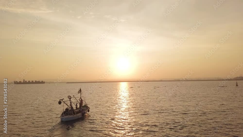 Fishing boat on the background of golden sunrise. Fishing boat on the background of golden sunrise.