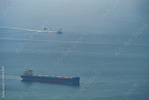 Cargo ships waiting for their turn in the bay of Gibraltar.  Logistics in the Mediterranean Sea.