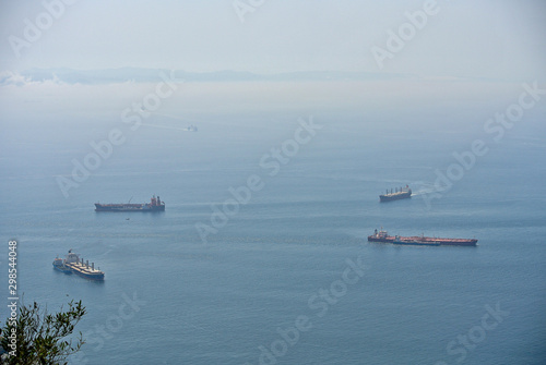 Cargo ships waiting for their turn in the bay of Gibraltar.  Logistics in the Mediterranean Sea.
