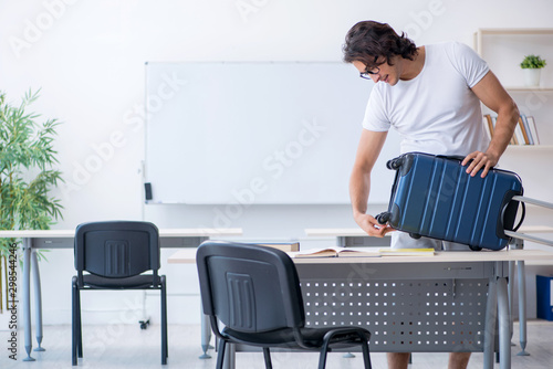 Young male student in front of whiteboard