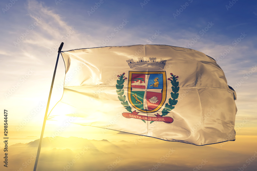 Santa Cruz do Sul of Brazil flag waving on the top sunrise mist fog