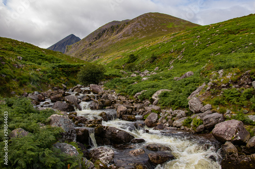 Nearby Carrantuohill Mountain, way to the pick, river and road, Co. Kerry, Ireland summer photo