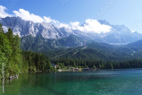 View of Eibsee lake in Bavaria, Germany with Mountain in the background and a hotel at the lake shore