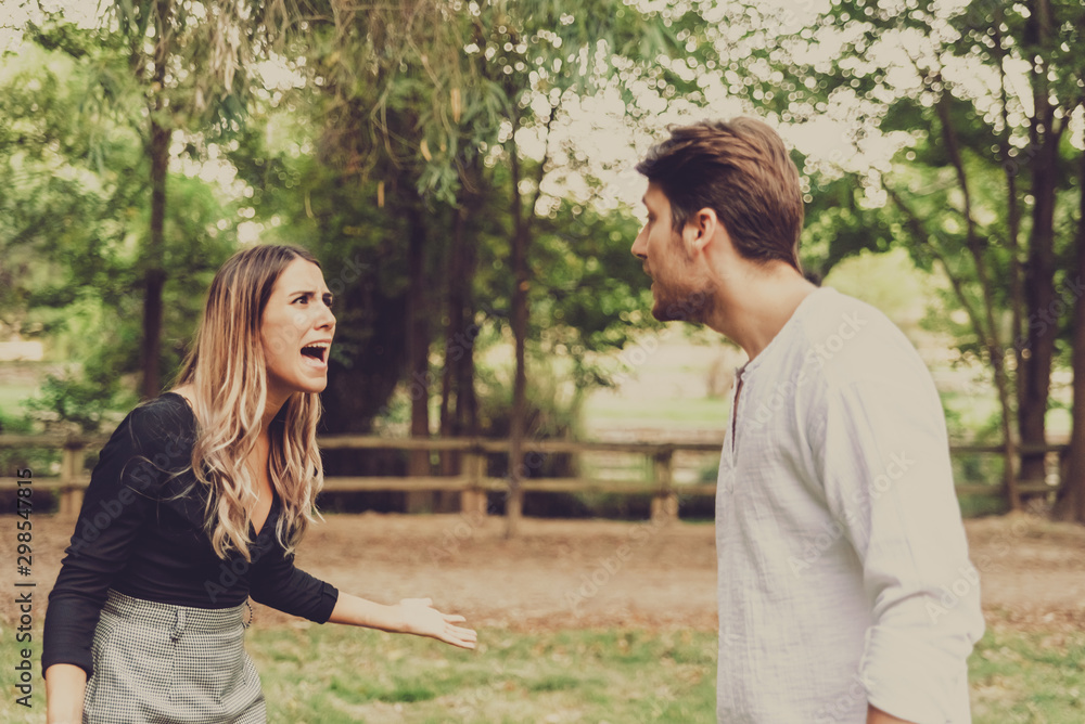 Woman defends herself screaming at a man who harasses her in a park. Woman defends herself screaming at a man who harasses her in a park.