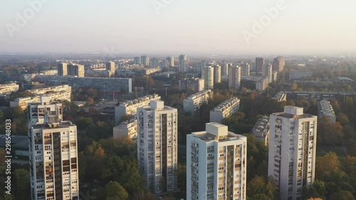 Croatia, city of Zagreb, sunset over residential towers of Novi Zagreb socialist district in autumn day, drone footage