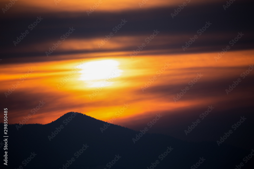 Apuseni mountains at sunset in golden light and in silhouette