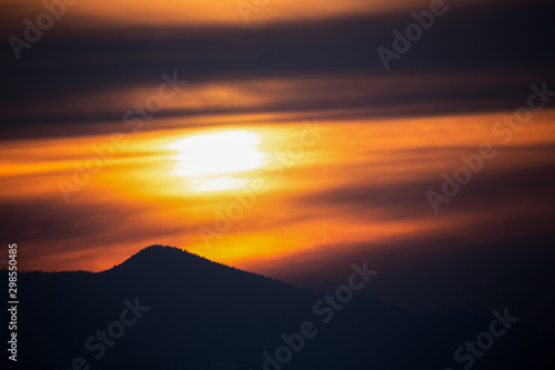 Apuseni mountains at sunset in golden light and in silhouette © andrei