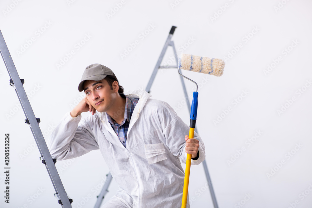Painter working at construction site Painter working at construction site