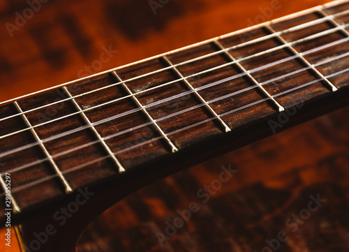 Shot of Classical Guitar Strings on a Rustic Wooden Table