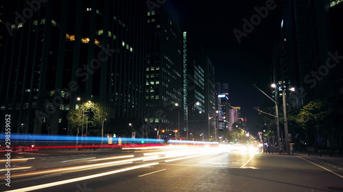 Beautiful night of Seoul road traffic, view on the busy intersection in Gangnam District. Cars, buses and other vehicles passing by creating picturesque light trails. © railwayfx