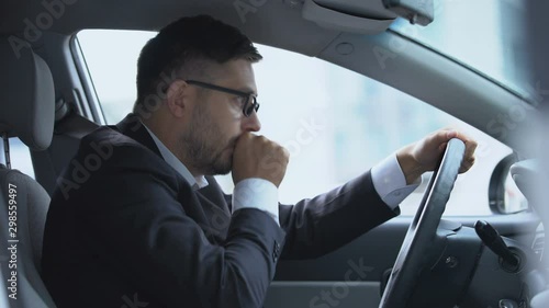 Male driver stopping his car because of cough attack, risk of pneumonia, asthma