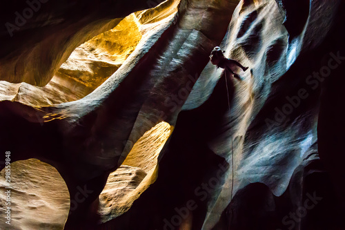 Female Canyoneer Rappels in the Cathedral Room photo