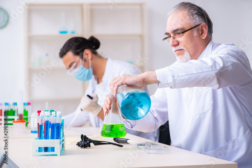 Two chemists working in the lab