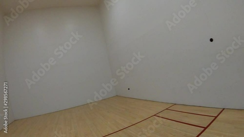 FPV - First person view playing racquetball - ball bounces off front wall for the serve, is returned high off opposite wall ceiling shot