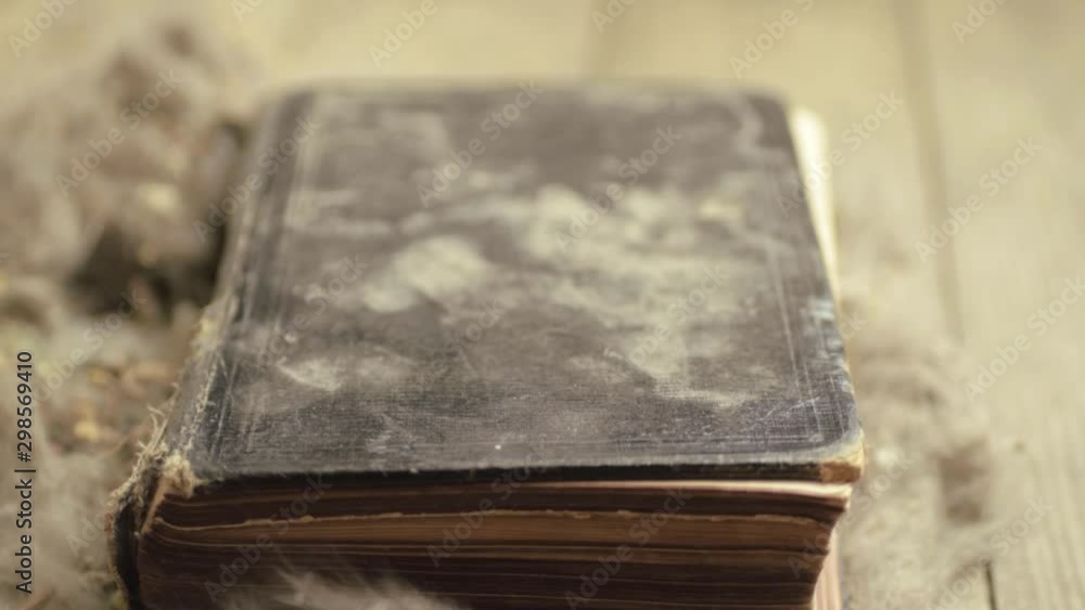 Wind blowing the pages of a dirty dusty old book Wind blowing the pages of a dirty dusty old book