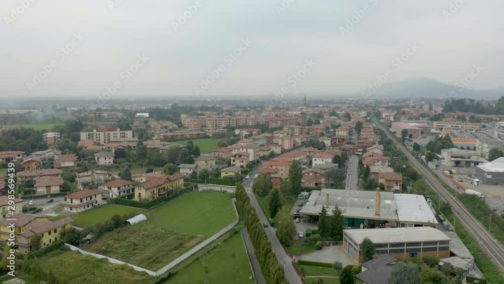 Aerial view of a small Italian town with a car driving on the road Aerial view of a small Italian town with a car driving on the road