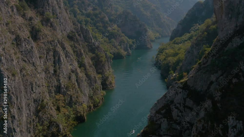 Flying between cliffs in Matka canyon in Macedonia on a sunny day Flying between cliffs in Matka canyon in Macedonia on a sunny day
