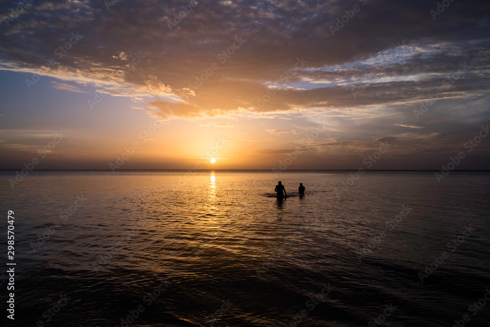 Fototapeta premium boat at sunset on rio beach in amazon.