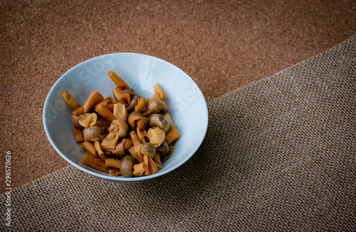 Popia Simpul Kasih is a Traditional Malaysian food or snack. Made from crispy fried wheat flour with sweet dry fish inside. photo