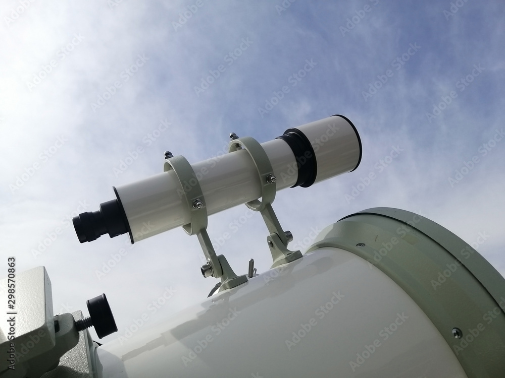 viewfinder of telescope, viewfinder of refracting device instrument for land lunar or planetary observation of distant object, magnified by lenses. viewfinder of telescope, viewfinder of refracting device instrument for land lunar or planetary observation of distant object, magnified by lenses.