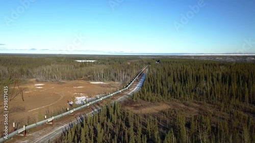 Sweeping wide angle aerial shot of the Copper River Valley in the Alaskan Interior with an oil pipeline running through the forest photo