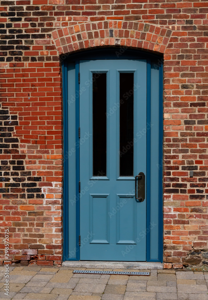 Blue door and brick walls in the old town 