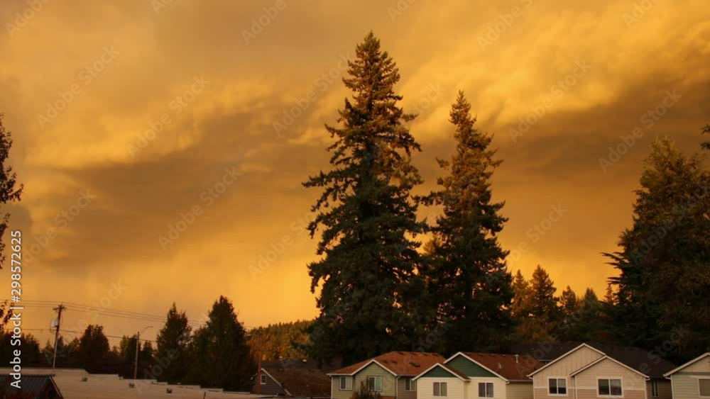 Timelapse of dramatic thunderstorm clouds aggressively approaching the city suburbs and dumping a lot of rain on the neighborhood. Dramatic storm clouds roll above a neighborhood before raining hard. Timelapse of dramatic thunderstorm clouds aggressively approaching the city suburbs and dumping a lot of rain on the neighborhood. Dramatic storm clouds roll above a neighborhood before raining hard.