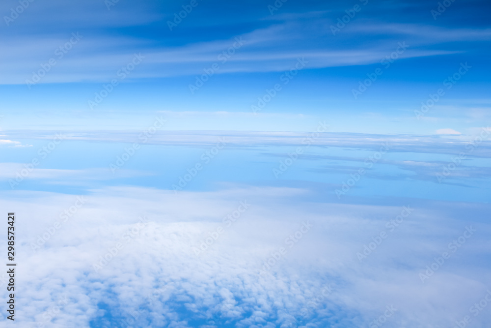 Beautiful of cloud on blue sky background at the winter season.Top view in airplane.