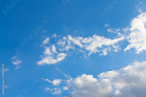 The white cloud that floats in the sky freely without shapes. Beautiful of cloud on blue sky background.