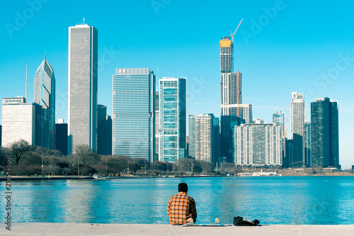Wallpaper Mural Person sitting on Lake Michigan in Chicago Torontodigital.ca