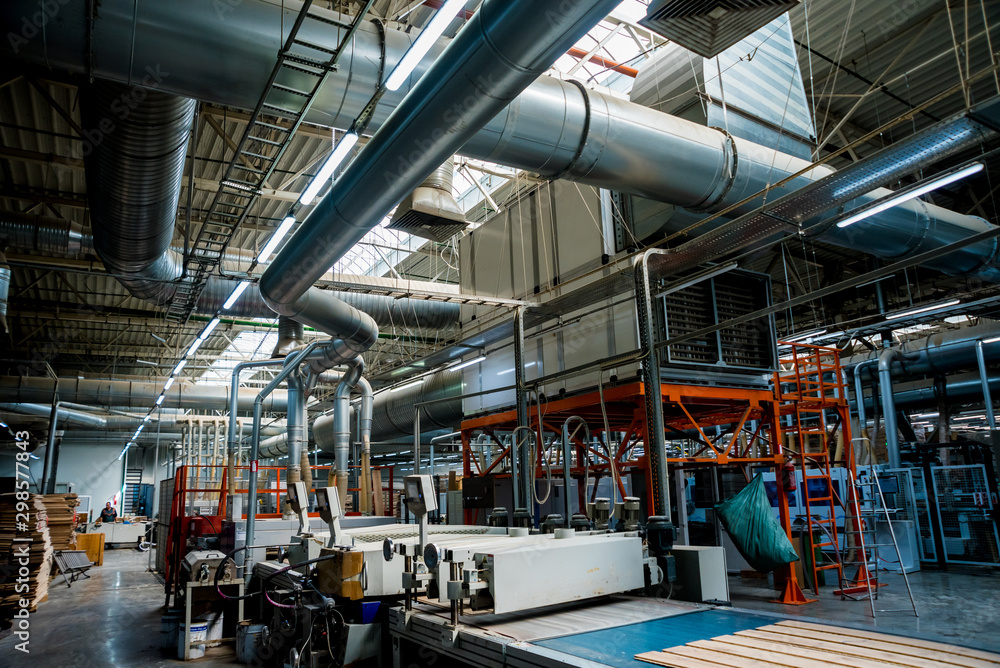 Fototapeta premium Production line of the wooden floor factory. CNC automatic woodworking machine.