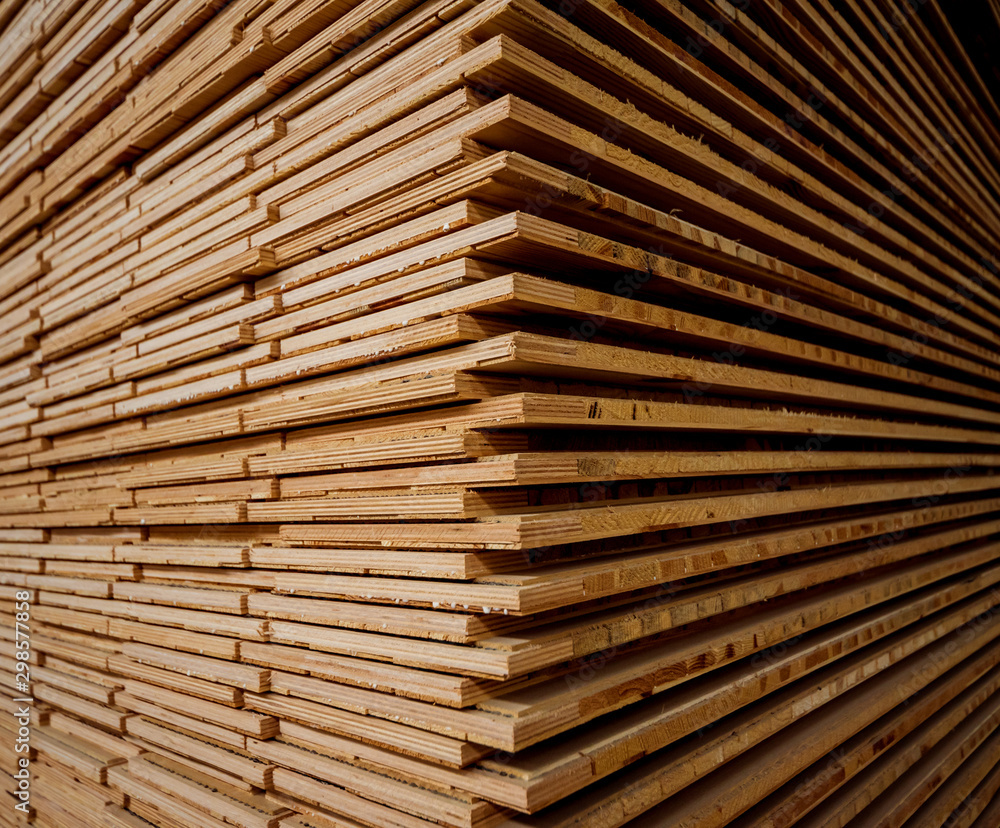 Stack of natural rough wooden boards. Wooden boards, lumber, industrial wood. Stack of natural rough wooden boards. Wooden boards, lumber, industrial wood.
