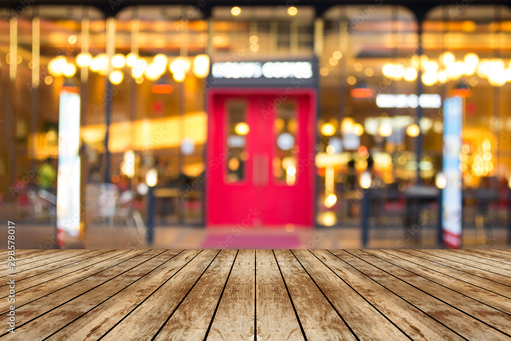 Top desk with blur restaurant background,wooden table Top desk with blur restaurant background,wooden table