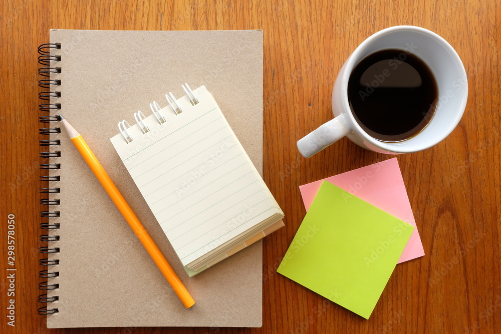 note paper and coffee on wooden table note paper and coffee on wooden table
