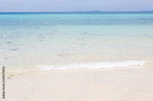 Blue sea waves summer background. Sand beach