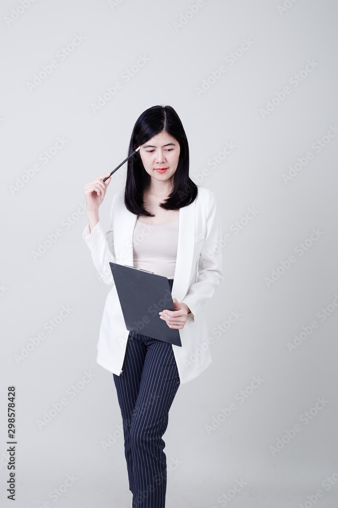 Asian business woman pencil with holding clip board Asian business woman pencil with holding clip board