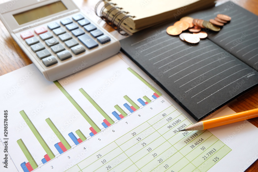 graph paper and coin with business concept graph paper and coin with business concept