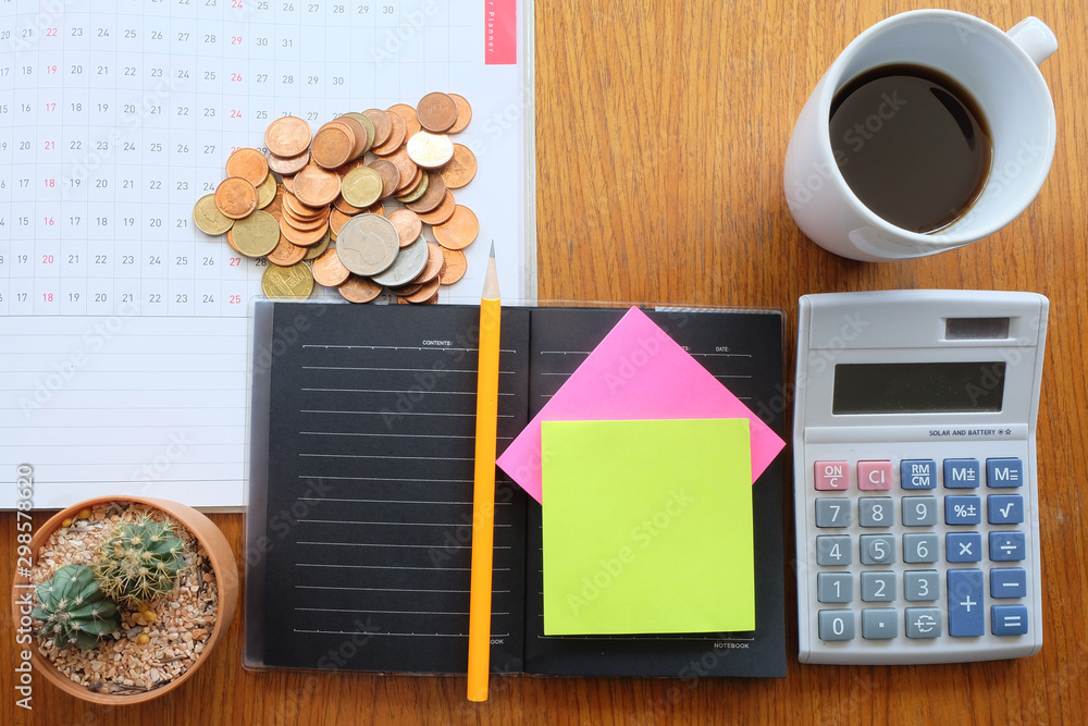 Naklejka premium coin and planner with business concept