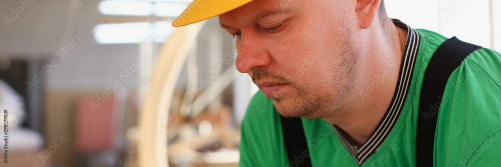 Obraz premium Portrait of young attractive man in work