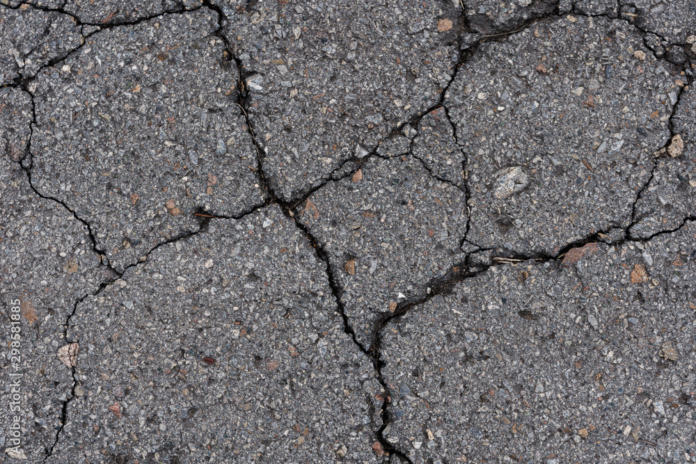 Obraz premium old broken cracked asphalt texture background