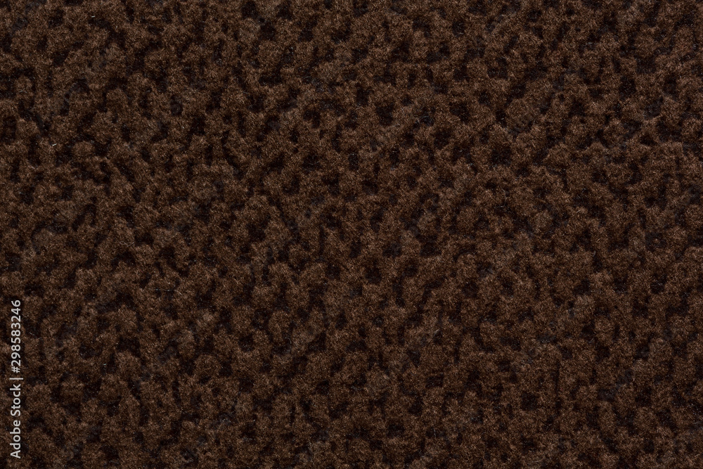 Saturated brown textile background close up. Saturated brown textile background close up.