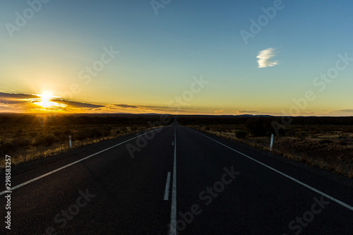 straight road through the nullarbor dessert of Australia at sunset, South Australia, Australia © Martin