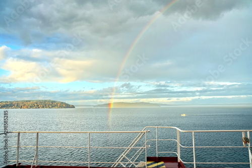 Colorful views of the rainbow against the sky, clouds and sea horizon. Commencement Bay,Tacoma,USA      A.