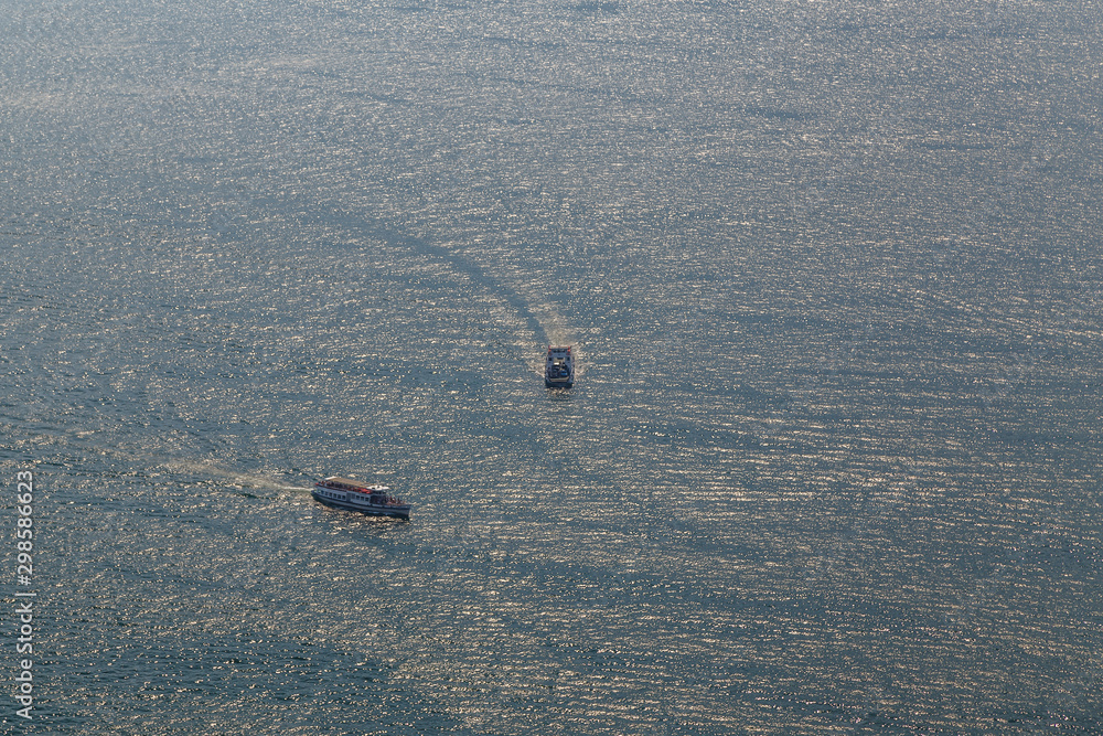 Fototapeta premium An aerial view to ships on Como lake, Italy