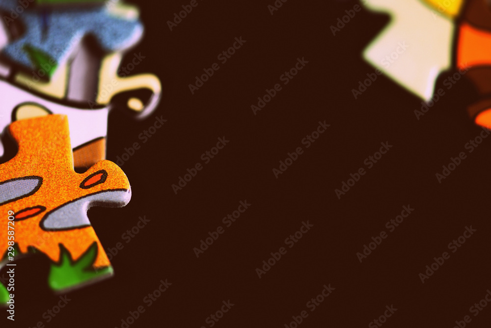 Children's puzzles on a dark background close up. Retro style toned Children's puzzles on a dark background close up. Retro style toned