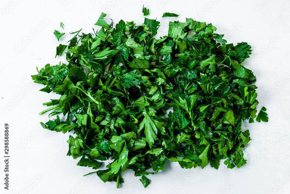Fototapeta premium Freshly chopped green parsley. Texture, background
