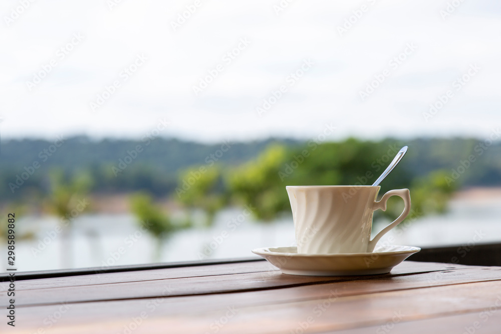 cup of coffee on wooden table nature